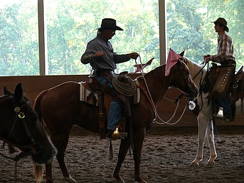 Chuck Forrest riding with flag