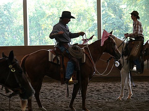 Chuck Forrest riding with flag