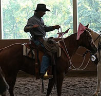 Chuck Forrest riding with flag